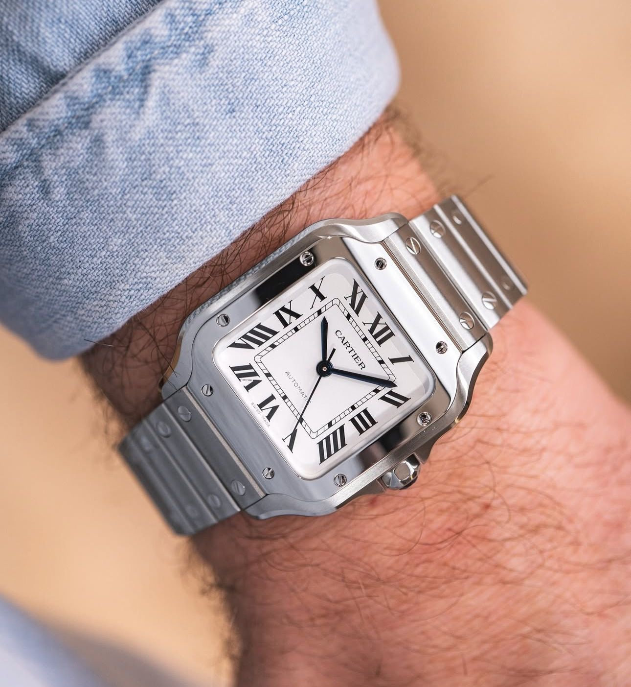 Santos de Large Automatic – 39.8 mm × 47.5 mm. Iconic design, black dial, ADLC bezel, interchangeable strap & timeless elegance